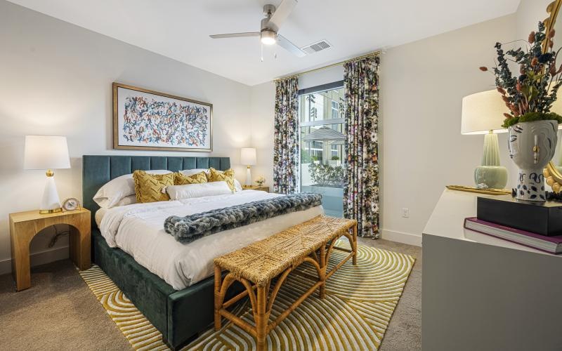 a bedroom with a bed and a chair