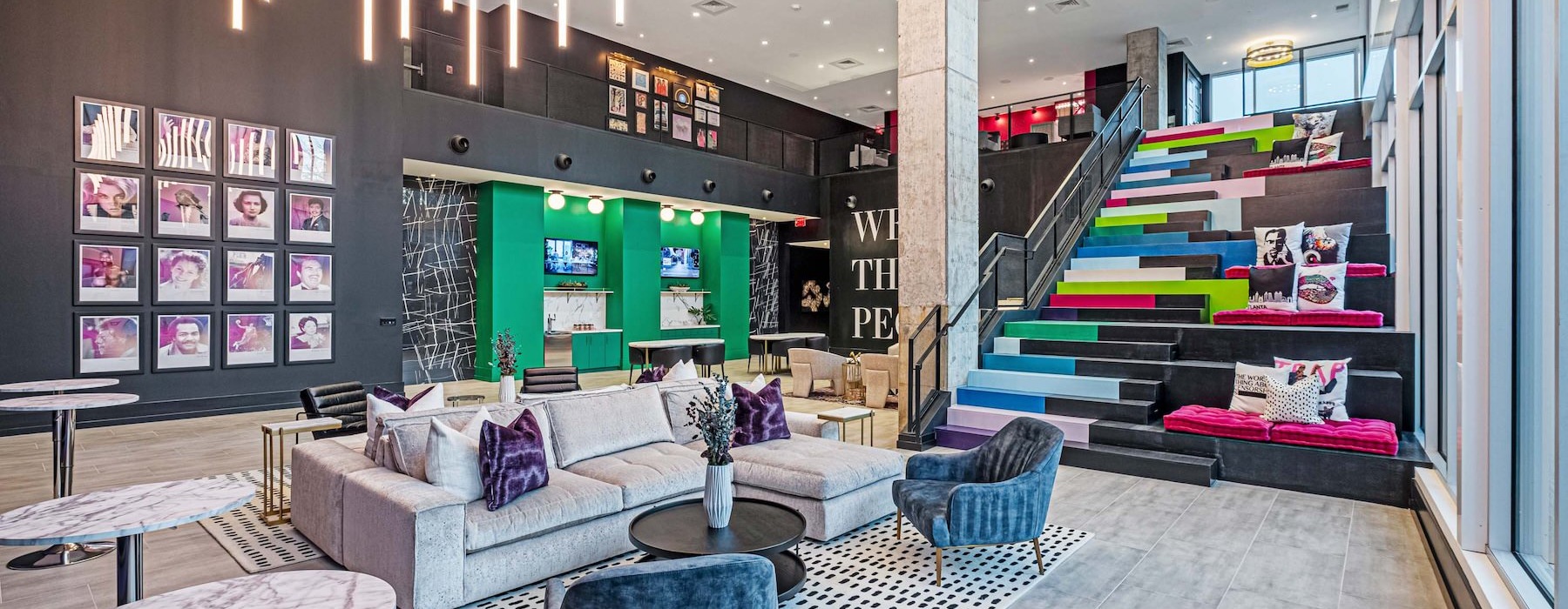 a clubroom with a couch and stairs