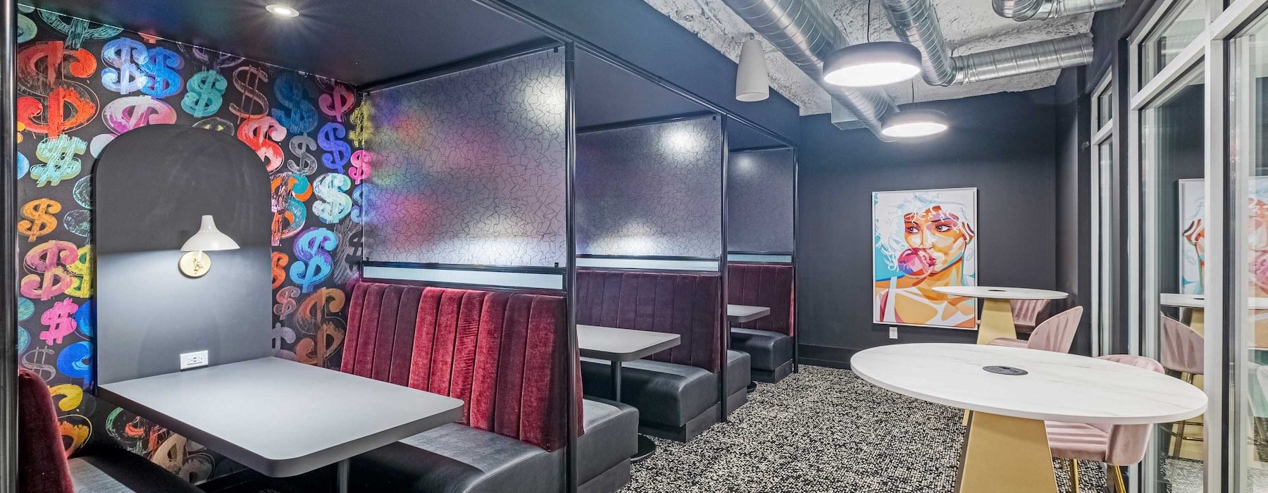 a clubroom with booths and tables