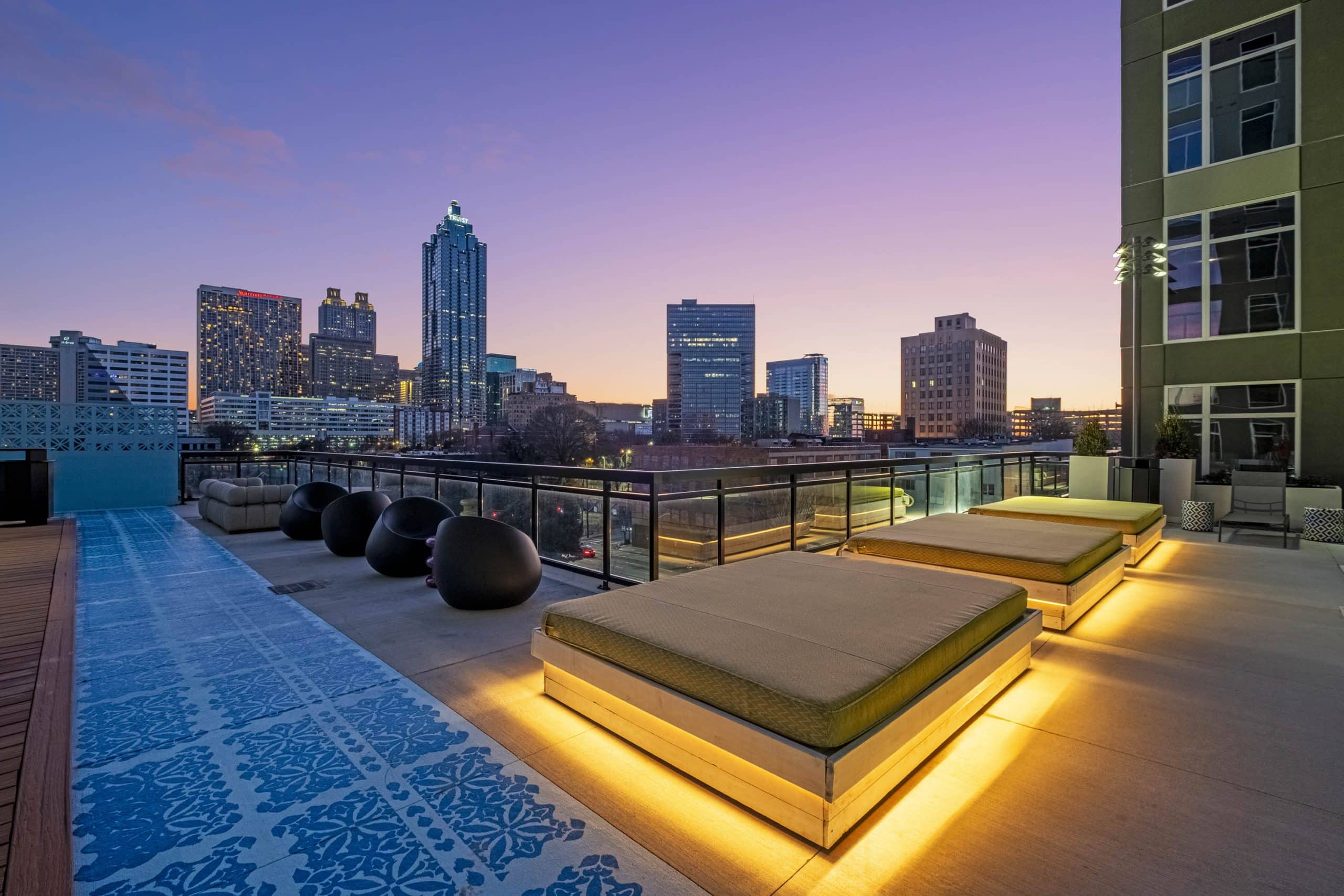 Furnished courtyard at dusk with skyline